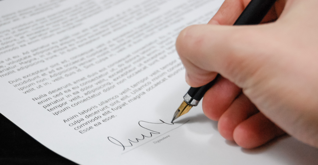 Man signing a document